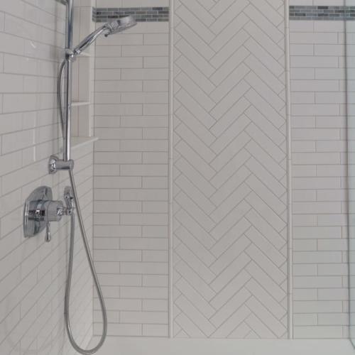 master-bathroom-shower-walls-sonoma-pure-white-gloss-ceramic-tile-herringbone-sally-blue-accent-recessed-niche